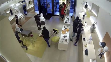 lv got robbed|14 people raid Louis Vuitton store near Chicago .